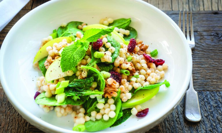 Warm Pearl Couscous Bowl with Spinach, Apple, Walnuts, and Tahini Dressing