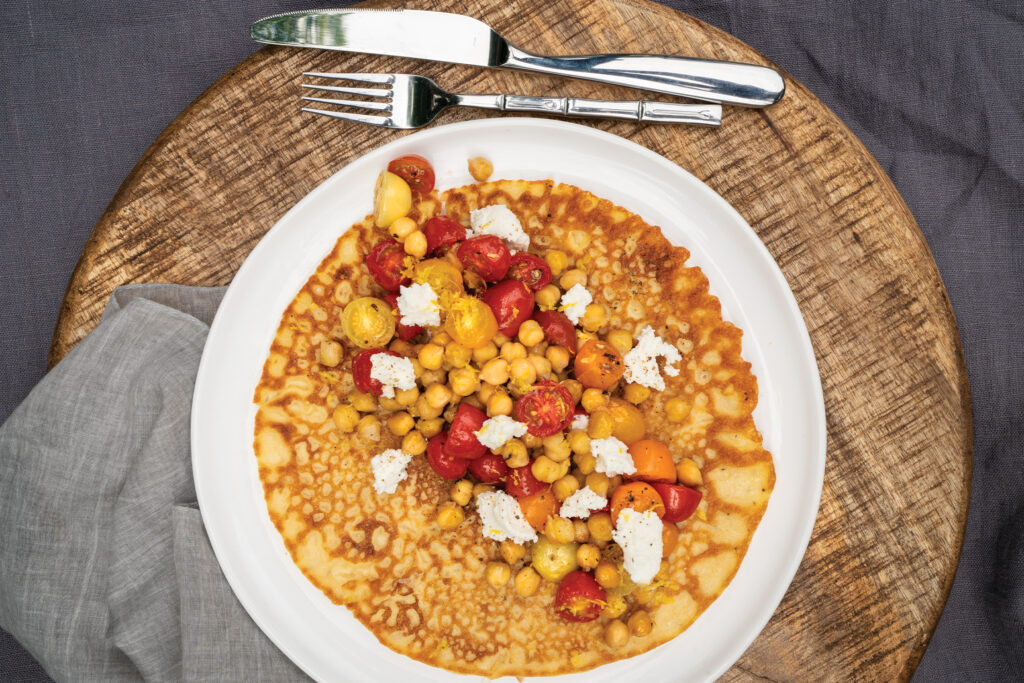 Socca Flatbreads with Roasted Cherry Tomatoes, Chickpeas, and Lemon Zest 