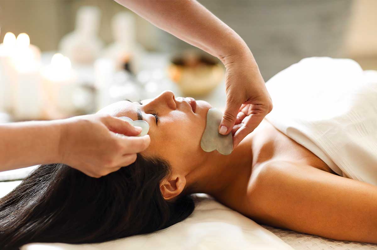 Face gua sha massage or beauty treatment in spa salon